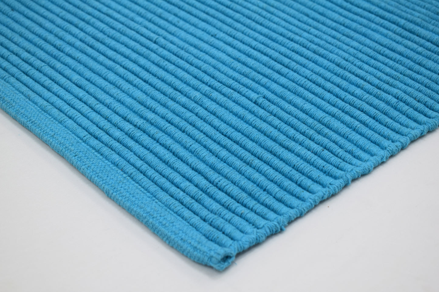 Tapete de playa tejido a mano Ocean Flame en Turquesa