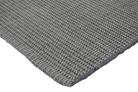 Tapete de playa tejido a mano en gris madera flotante